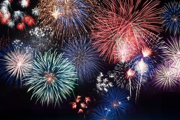 A vibrant display of colorful fireworks lighting up the night sky. A vibrant display of colorful fireworks lighting up the night sky.